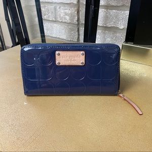 KATE SPADE zip around navy blue wallet GUC .